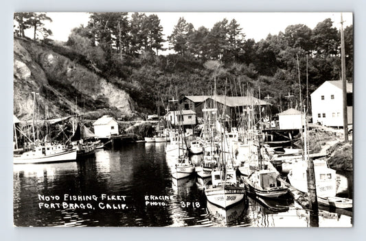 Fort Bragg California Noyo Fishing Fleet harbor boats RPPC postcard with fishing vessels docked along wooded waterfront