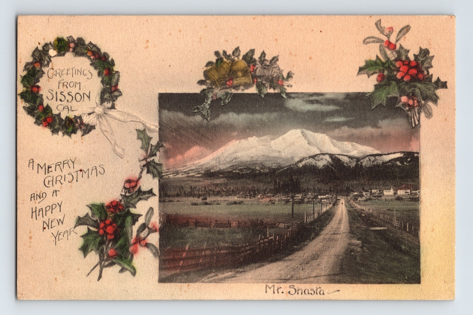 Mount Shasta with rural road and valley foreground framed by holly and Christmas wreath greeting from Sisson California