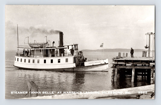 Black-and-white real photo postcard showing the steamer Anna Belle approaching Warren’s Landing dock at Islesboro, Maine.