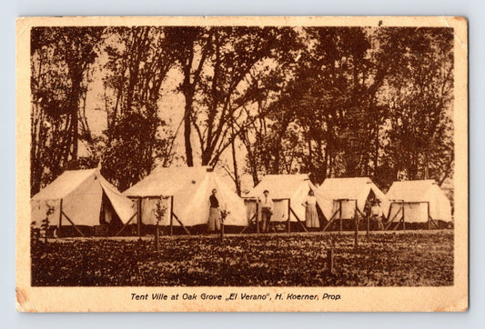 El Verano California Tent Ville at Oak Grove postcard showing rows of canvas camping tents beneath large trees with visitors standing outside temporary resort accommodations.