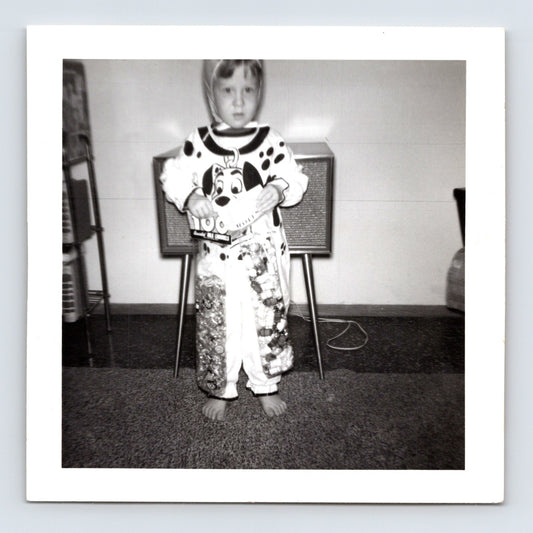 Child Dalmatian dog costume Halloween candy pajamas television living room snapshot mid century