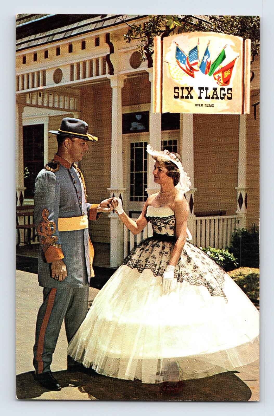 1960s Six Flags Over Texas postcard showing Civil War themed costumed couple in front of park building Dallas Fort Worth Texas