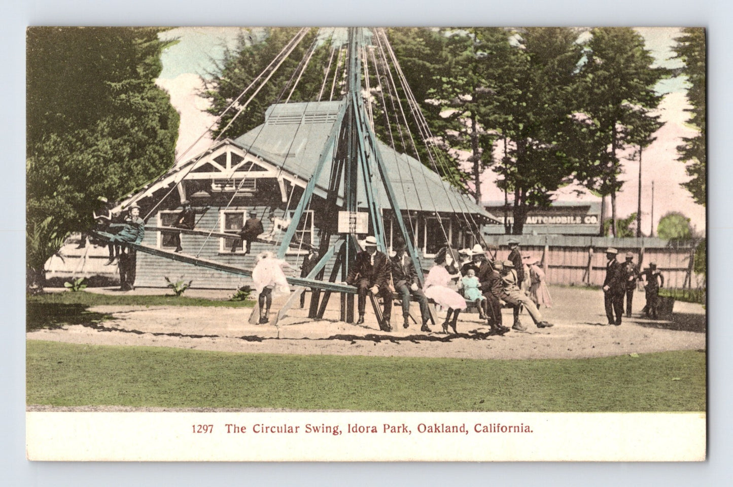 1910s postcard of Circular Swing ride at Idora Park in Oakland, California with riders on suspended chairs around central mast and pavilion structure behind