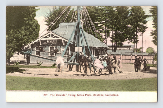 1910s postcard of Circular Swing ride at Idora Park in Oakland, California with riders on suspended chairs around central mast and pavilion structure behind
