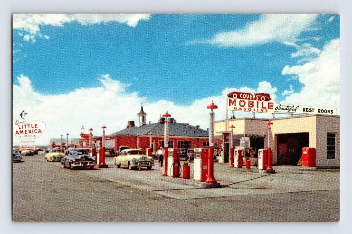 Covey’s Little America Mobile Gasoline station with pumps and classic cars Granger Wyoming 1960s postcard