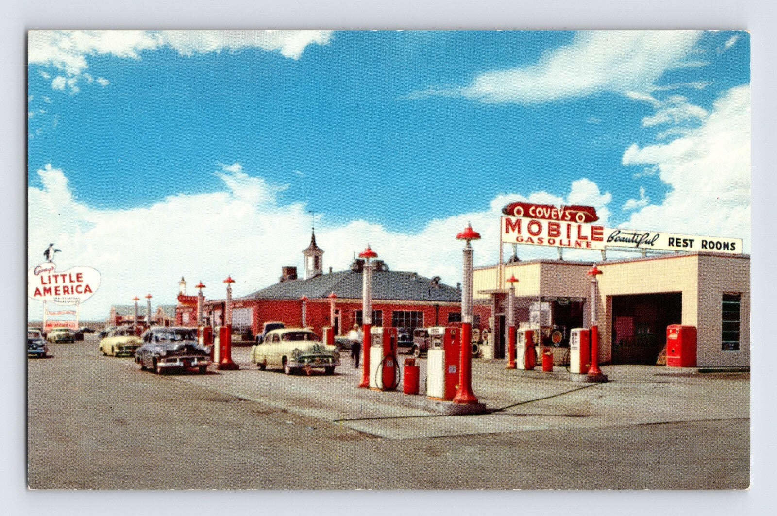 Covey’s Little America Mobile Gasoline station with pumps and classic cars Granger Wyoming 1960s postcard