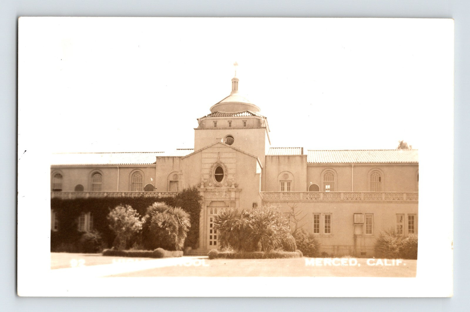 Merced California High School 1940s RPPC sepia campus facade with central dome and palm trees