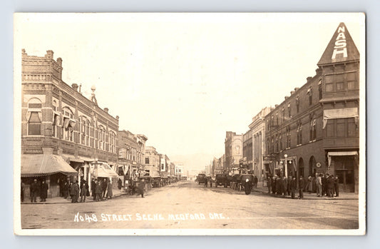 Real photo postcard showing Main Street in Medford, Oregon, with the Nash Hotel visible along the downtown commercial block; postmarked 1924.