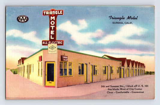 Color linen postcard advertising the Triangle Motel in Eureka, California, featuring a streamlined roadside motor court with vertical neon-style signage along U.S. Highway 101.