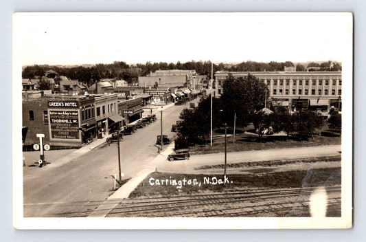 Carrington North Dakota downtown street view railroad tracks automobiles real photo postcard 1940s