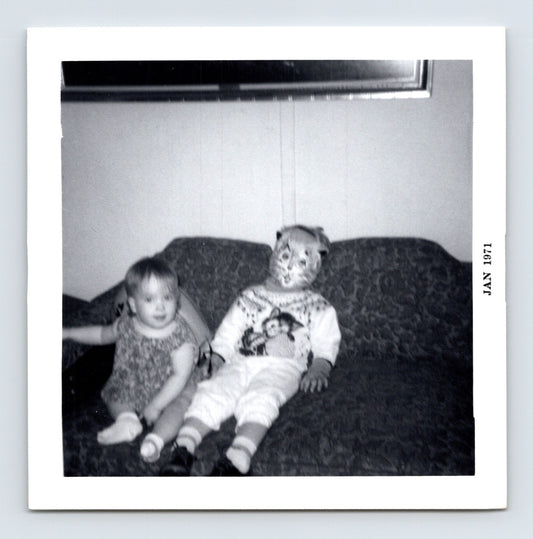 Halloween toddler child mask couch snapshot 1971 baby costume living room vintage photo