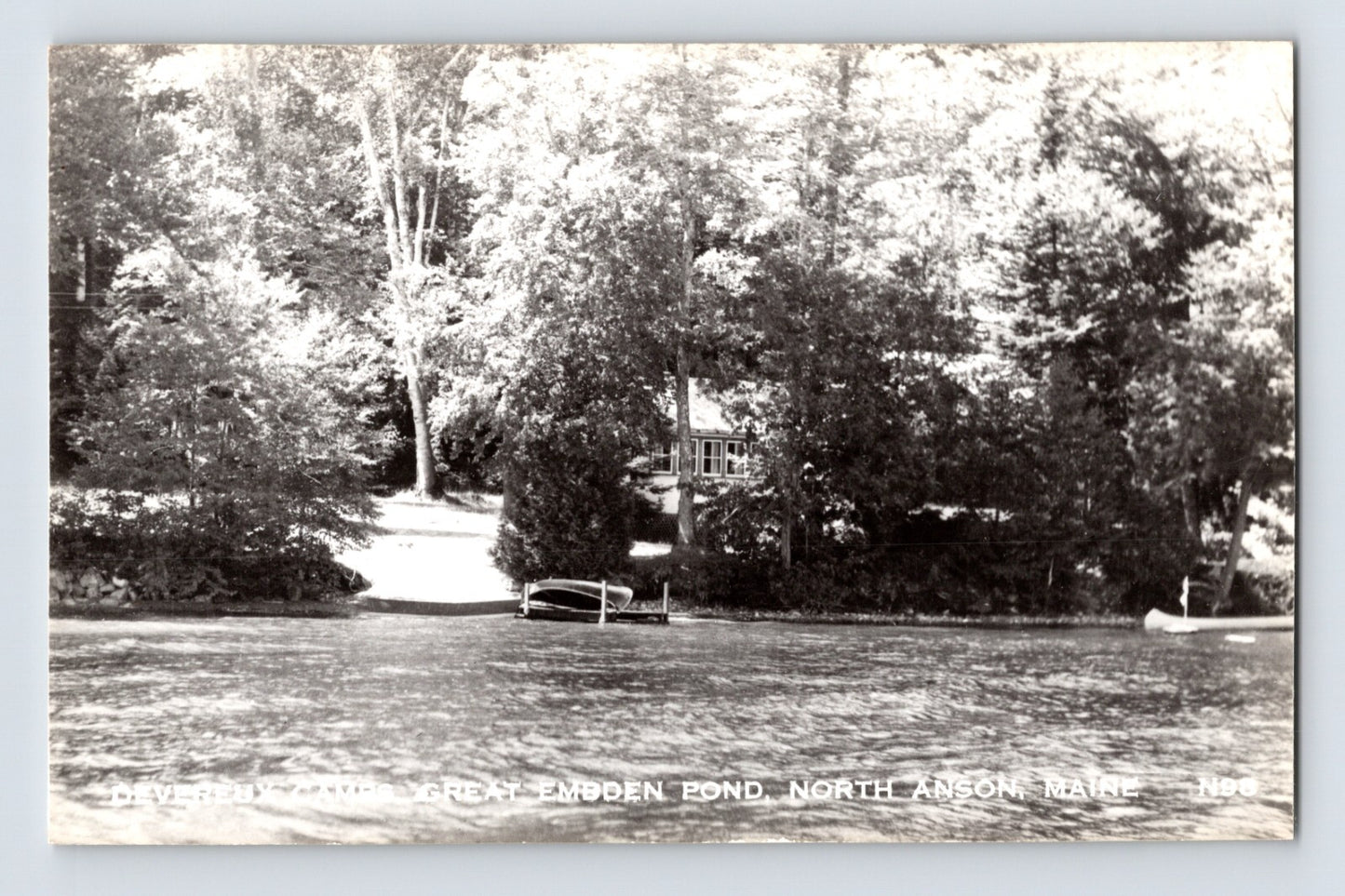 North Anson Maine Embden Pond Devereux Camp shoreline dock canoe trees RPPC photo 1950s