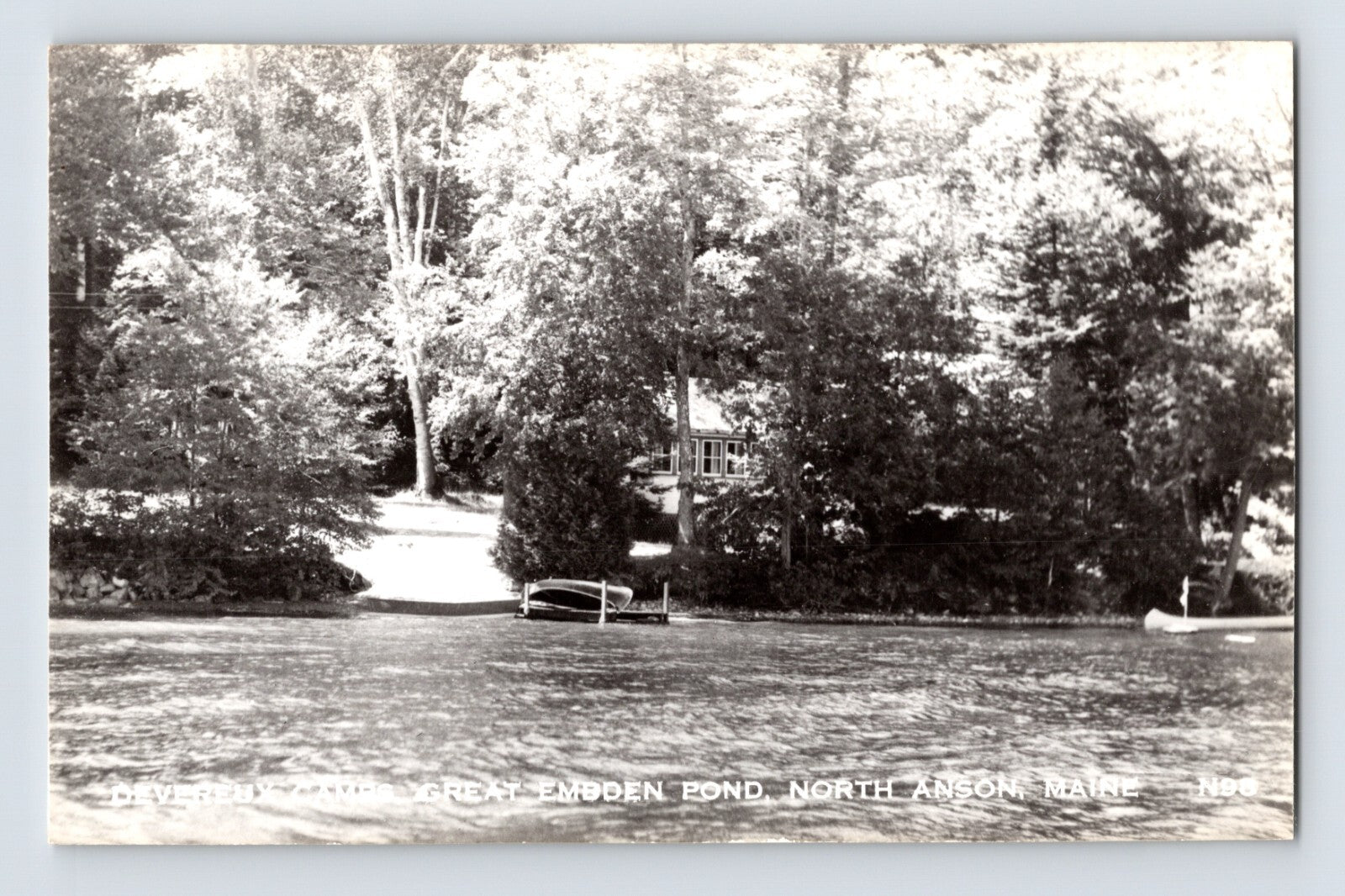 North Anson Maine Embden Pond Devereux Camp shoreline dock canoe trees RPPC photo 1950s