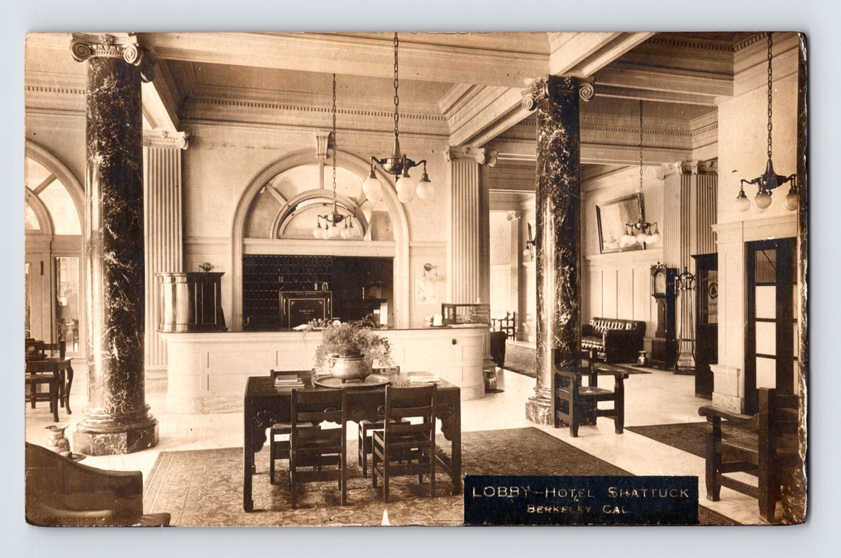 Sepia interior view of Hotel Shattuck lobby with marble columns and reception desk in Berkeley California 1910s RPPC
