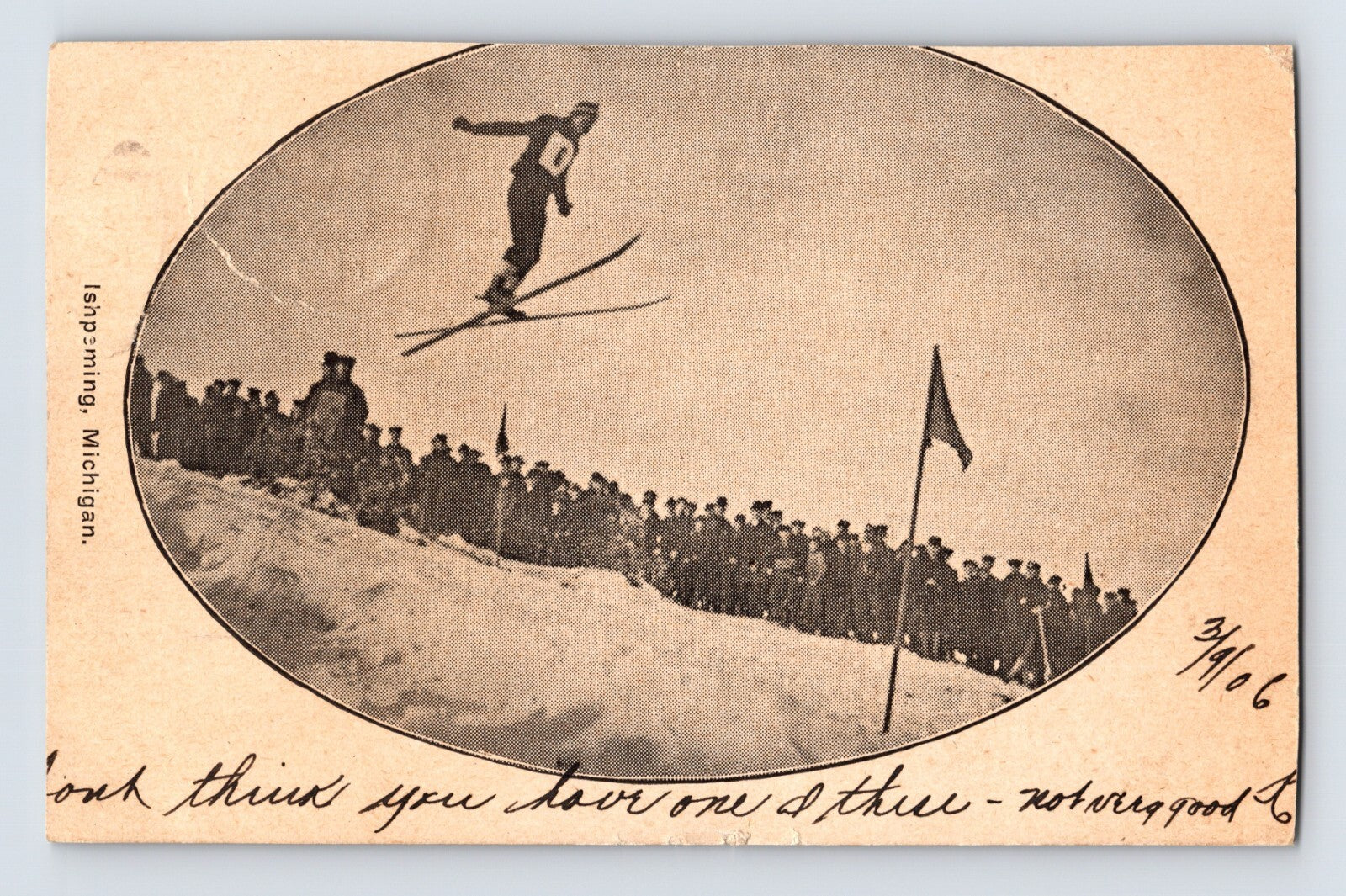 Ishpeming Michigan ski jumping postcard showing an early skier airborne above a crowd during a winter sporting exhibition.