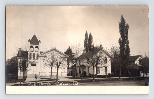 Real photo postcard of Methodist Church in Auburn California showing bell tower and adjacent residence pre 1907