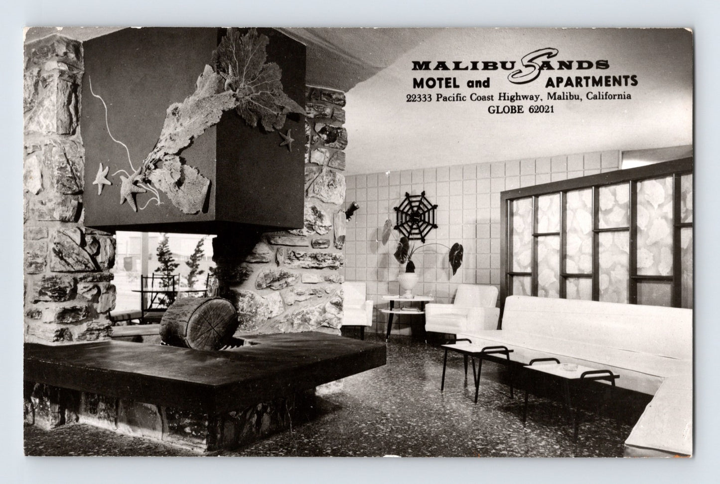 Malibu California Malibu Sands Motel apartments lounge interior RPPC postcard with modern fireplace and mid-century seating