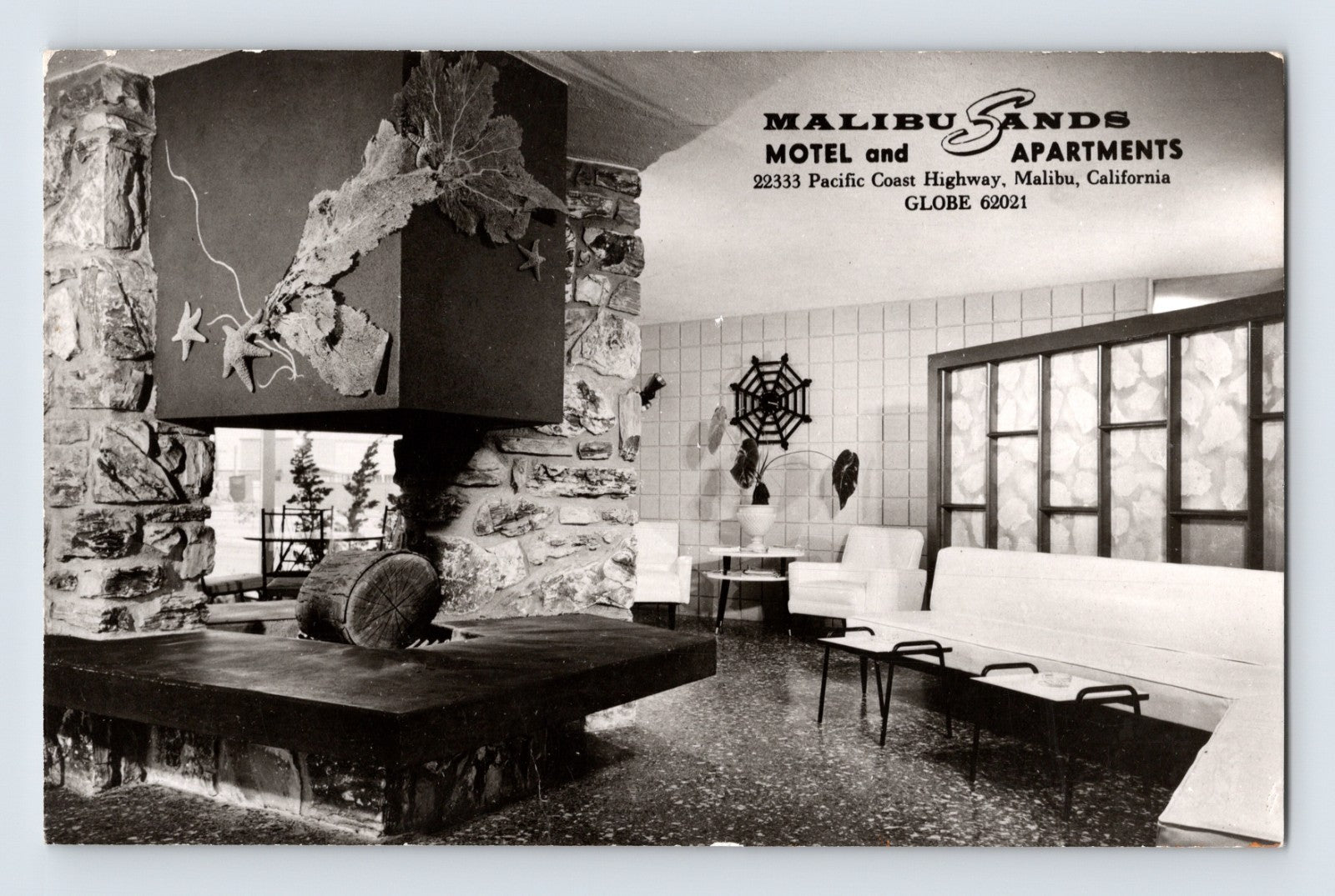 Malibu California Malibu Sands Motel apartments lounge interior RPPC postcard with modern fireplace and mid-century seating