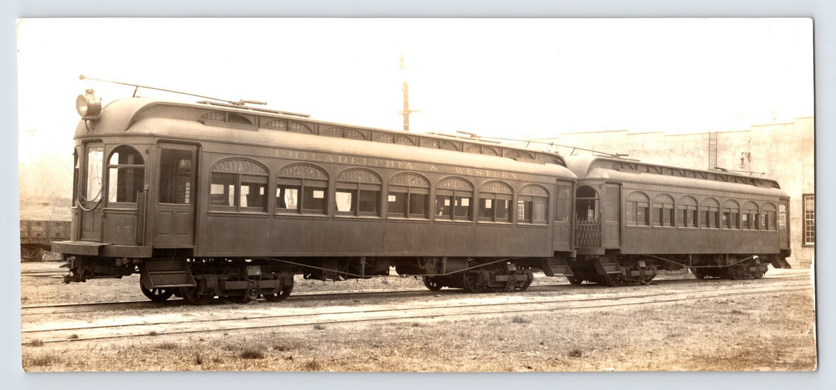 Sepia photograph showing two Western Electric interurban passenger cars on tracks in Philadelphia Pennsylvania circa 1910s