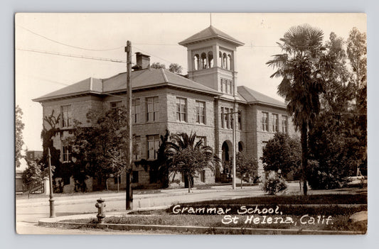 St Helena California grammar school building with central tower palm trees street view 1920s RPPC postcard AZO