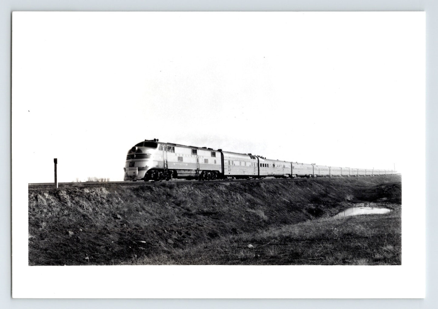 Burlington Route Zephyr streamlined passenger train in open landscape Colorado 1948 railroad photograph