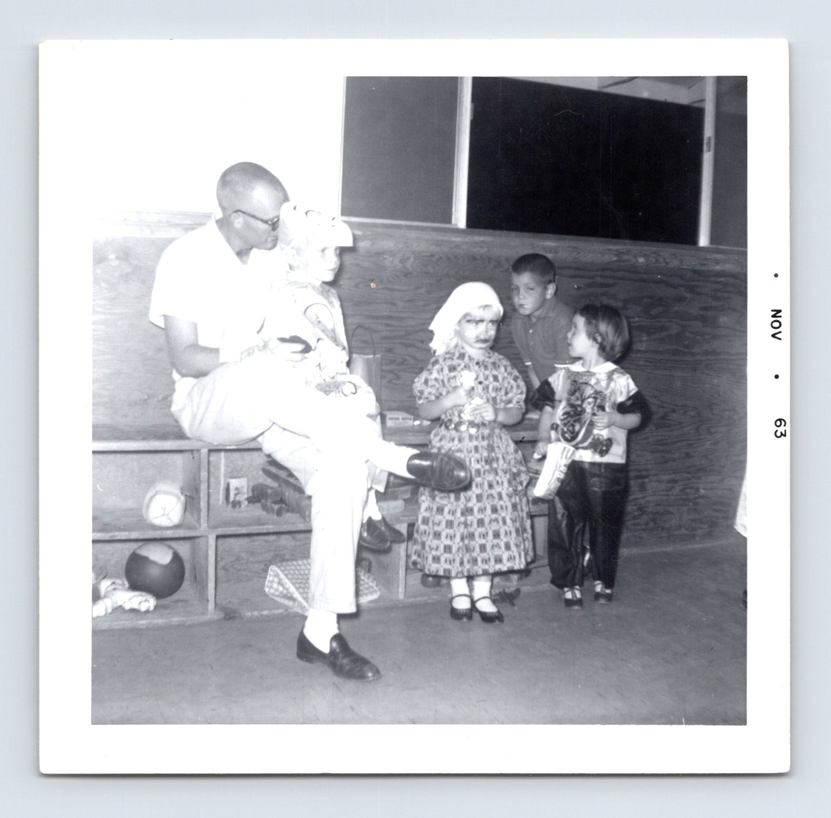 1963 Halloween classroom children costumes seated adult supervising vintage snapshot indoor party photo