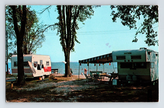 East Tawas Michigan city park campground 1973 postcard with campers trailers and lakeshore beach