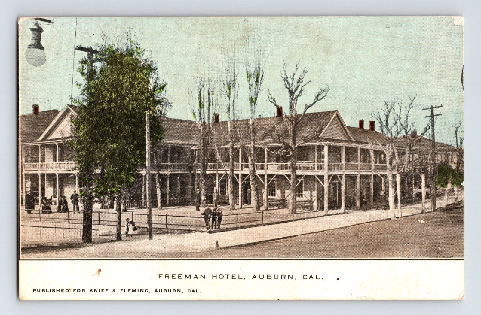 1909 Freeman Hotel in Auburn California with two-story wooden balcony and street scene