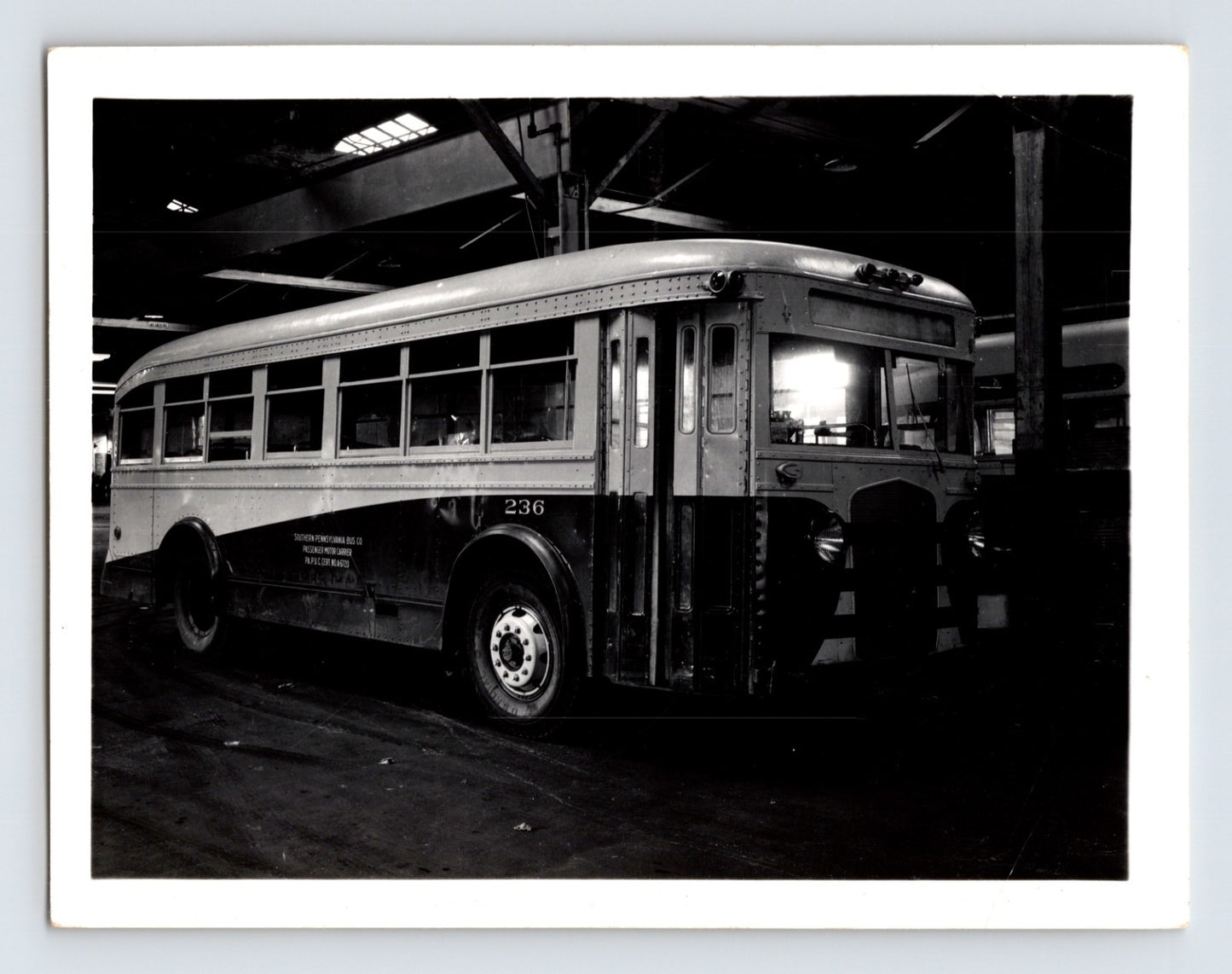 1940s Southern Pennsylvania bus ACF coach number 236 interior garage photograph showing transit vehicle with rounded body and large windows