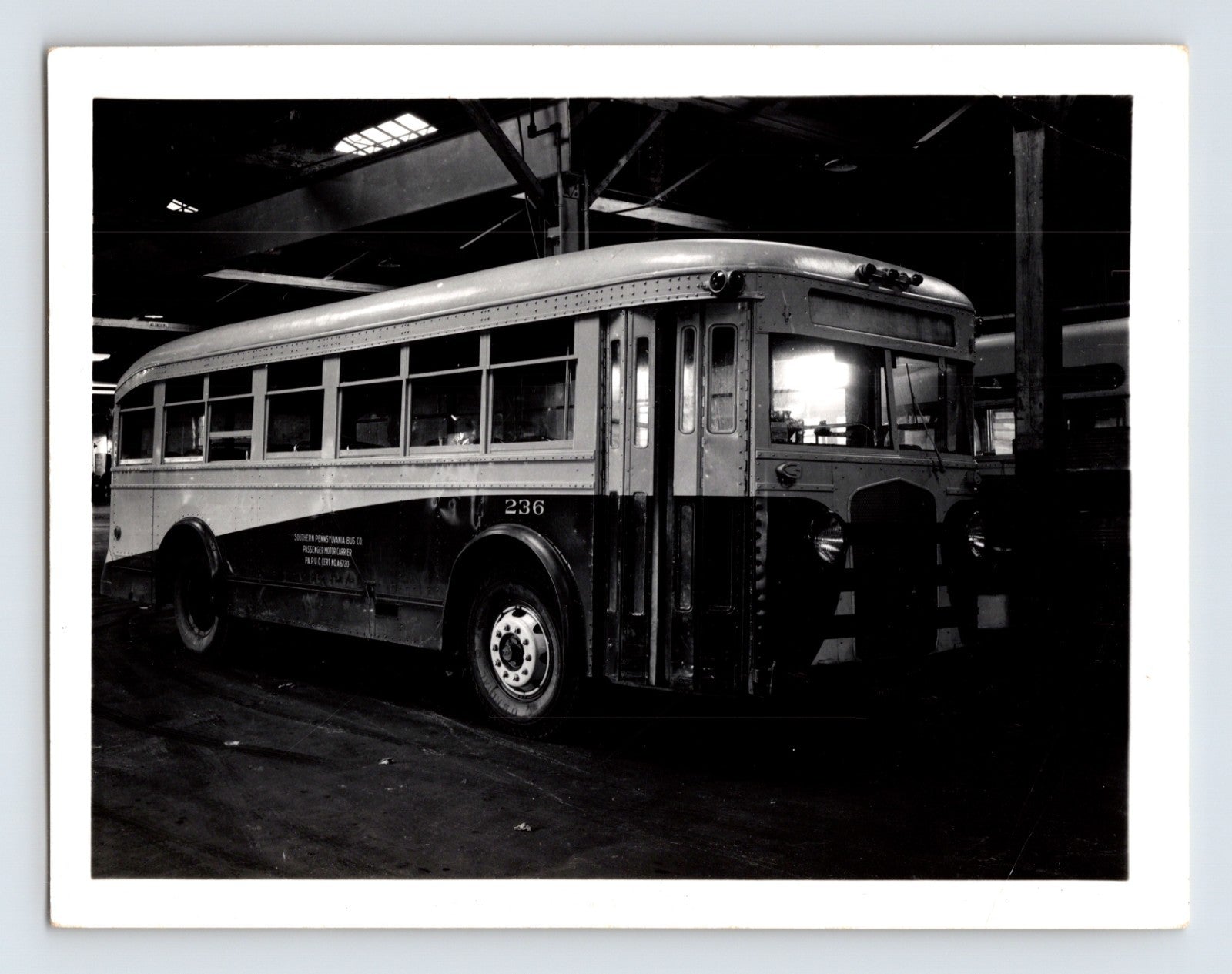 1940s Southern Pennsylvania bus ACF coach number 236 interior garage photograph showing transit vehicle with rounded body and large windows