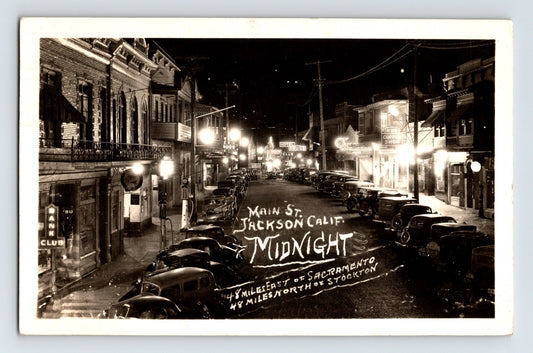 Jackson California Main Street downtown night neon lights cars 1950 RPPC postcard