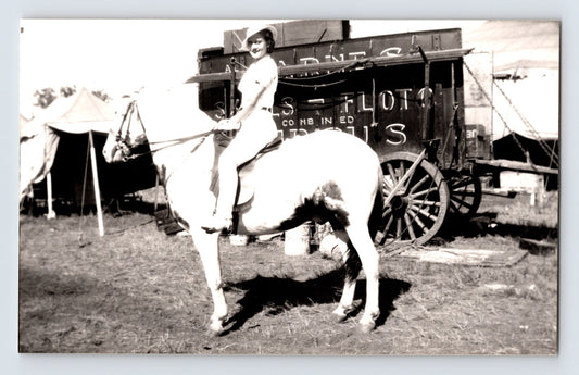 Barnes Sells Floto Circus woman performer riding horse beside circus wagon 1940s circus grounds photograph
