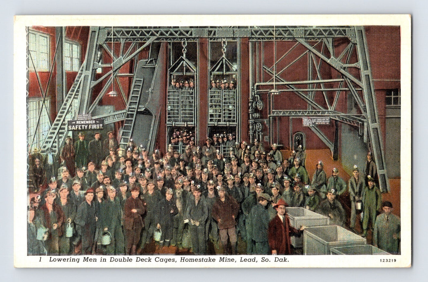 Lead South Dakota Homestake Gold Mine double deck cage lowering miners, large underground hoist structure and gathered workers, 1940s linen postcard