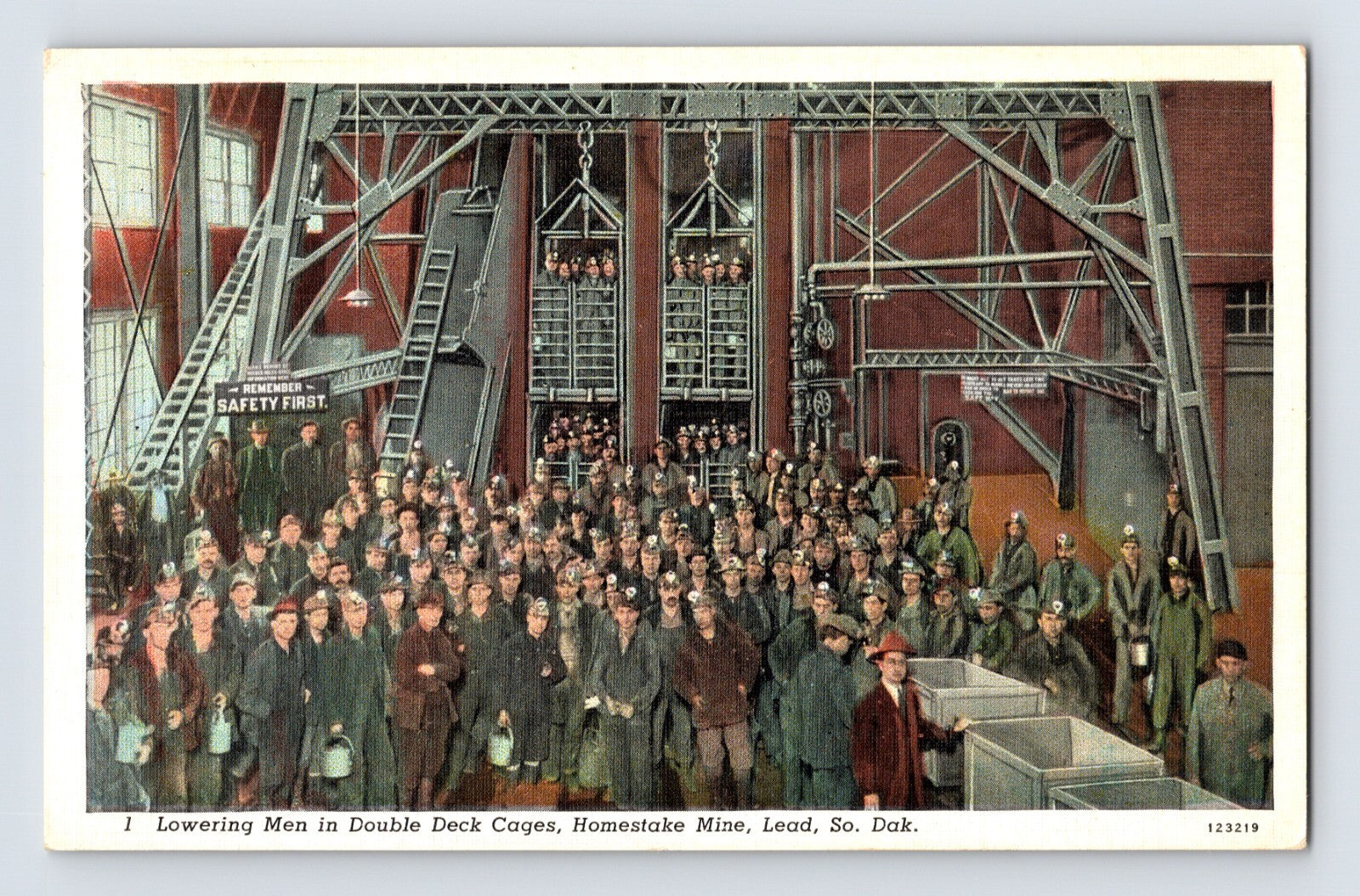 Lead South Dakota Homestake Gold Mine double deck cage lowering miners, large underground hoist structure and gathered workers, 1940s linen postcard