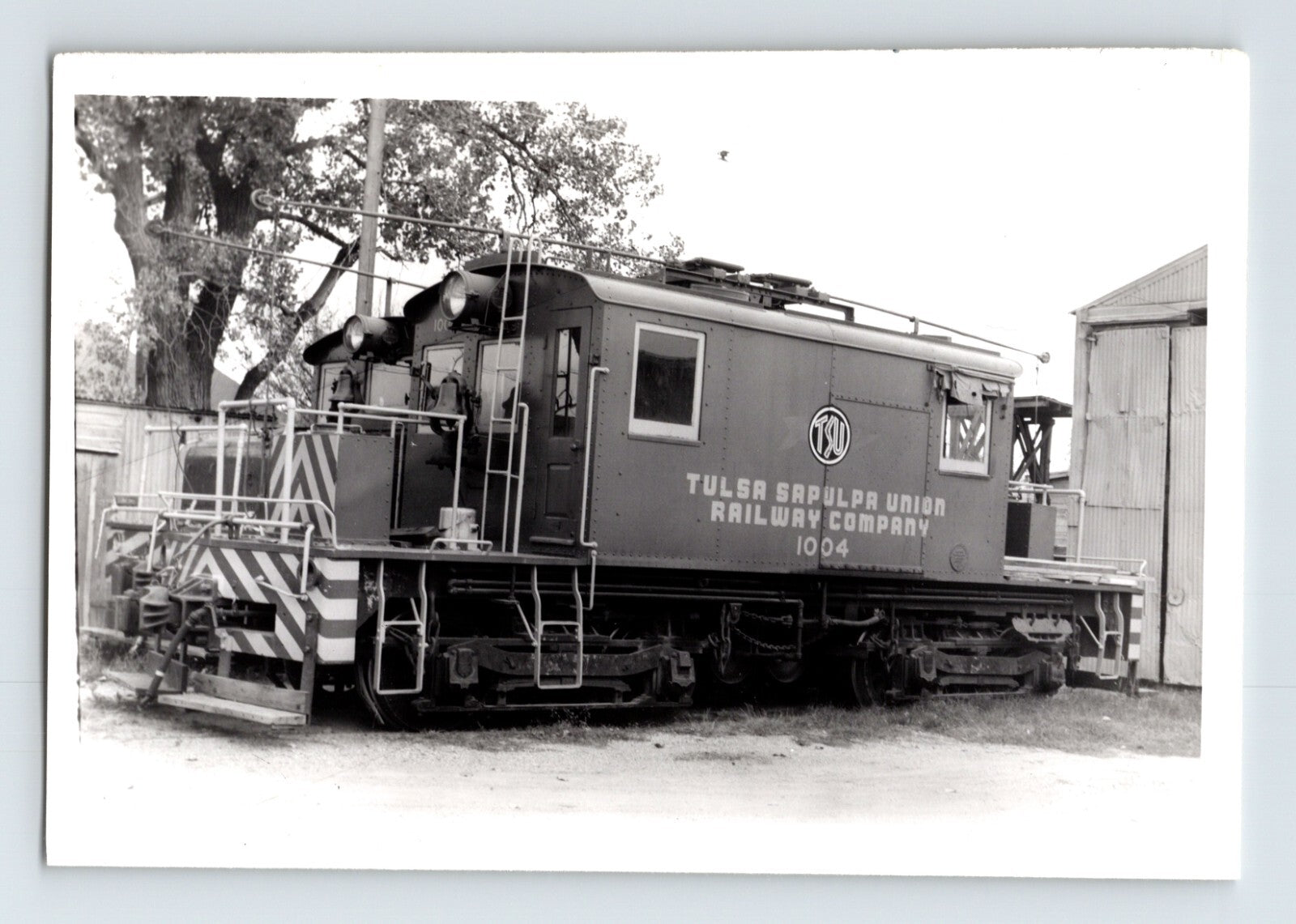 Vintage black and white photograph of a train car with 'Tulsa Southern Railway Company' branding.