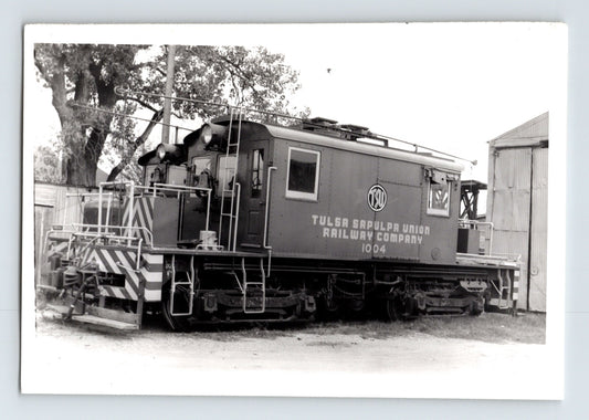 Vintage black and white photograph of a train car with 'Tulsa Southern Railway Company' branding.