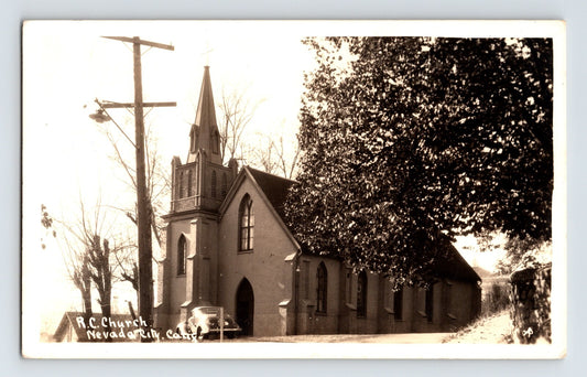 Nevada City California Catholic Church 1930s RPPC with steeple building automobile and tree foreground sepia tone DOPS paper