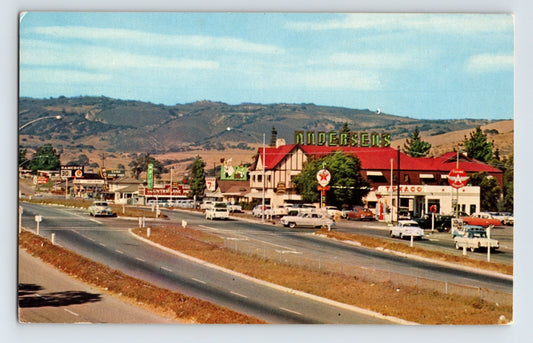 1960s color postcard of Andersen’s Pea Soup restaurant and Texaco station in Buellton, California with highway traffic and rolling hills in background