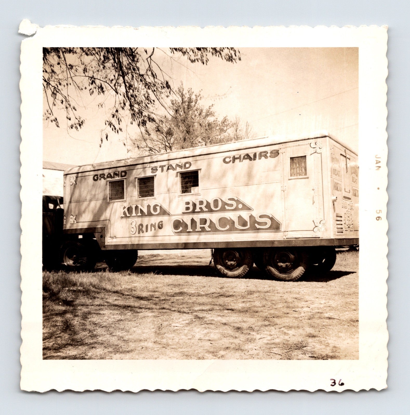 King Bros Circus 1956 photo of grandstand chair transport trailer with painted circus lettering - 3.5 x 3.5