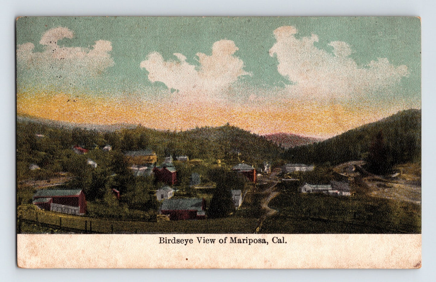 Colorized postcard bird’s-eye view of Mariposa, California, showing the small foothill town, winding roads, and surrounding Sierra landscape.