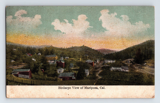 Colorized postcard bird’s-eye view of Mariposa, California, showing the small foothill town, winding roads, and surrounding Sierra landscape.