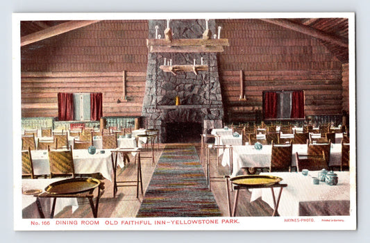 Yellowstone National Park Wyoming Old Faithful Inn dining room interior 1930s Haynes postcard with massive stone fireplace and log walls