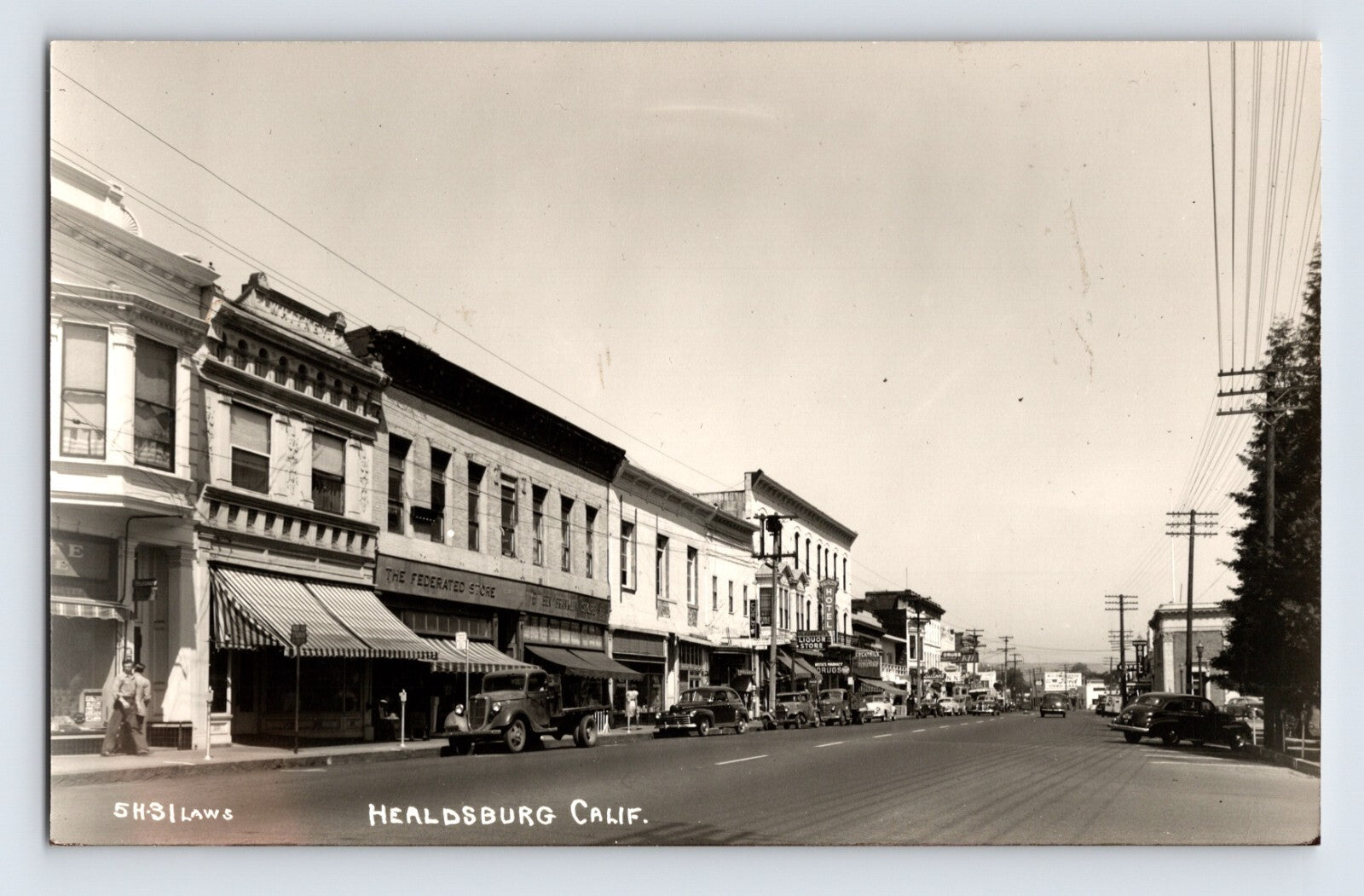 Healdsburg California downtown street view storefronts and parked cars 1940s real photo postcard