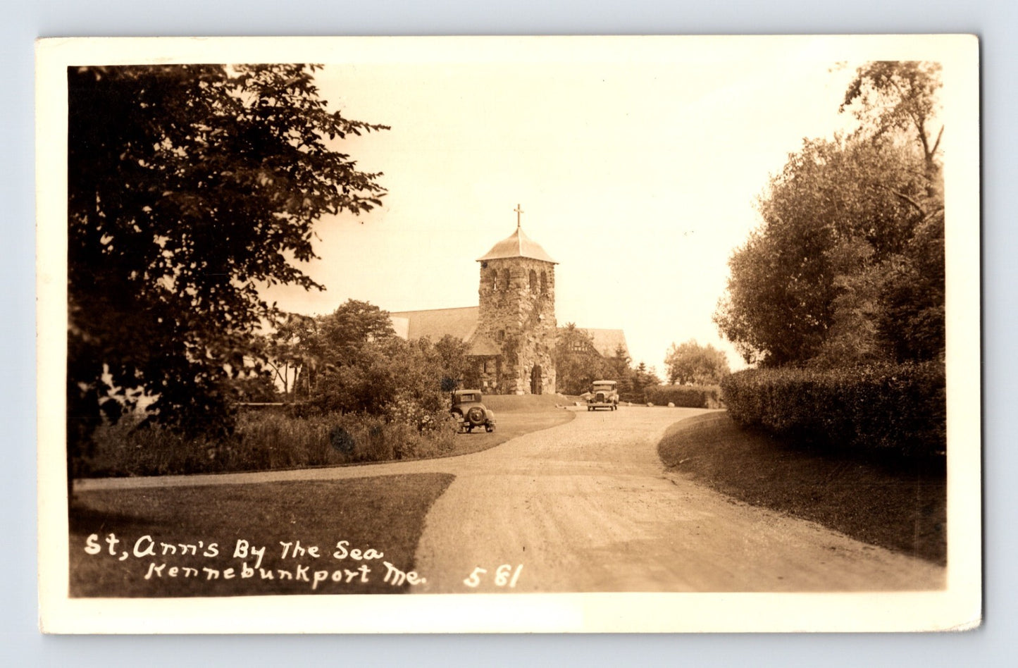 Real photo postcard of St Ann’s by the Sea church in Kennebunkport Maine showing stone chapel, curved drive, and early automobiles