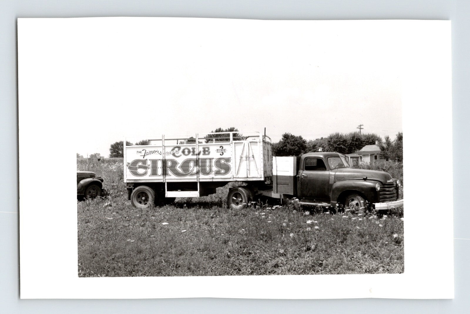 George Cole Circus 1954 truck with circus signage parked in grassy field Columbus Ohio black and white photograph