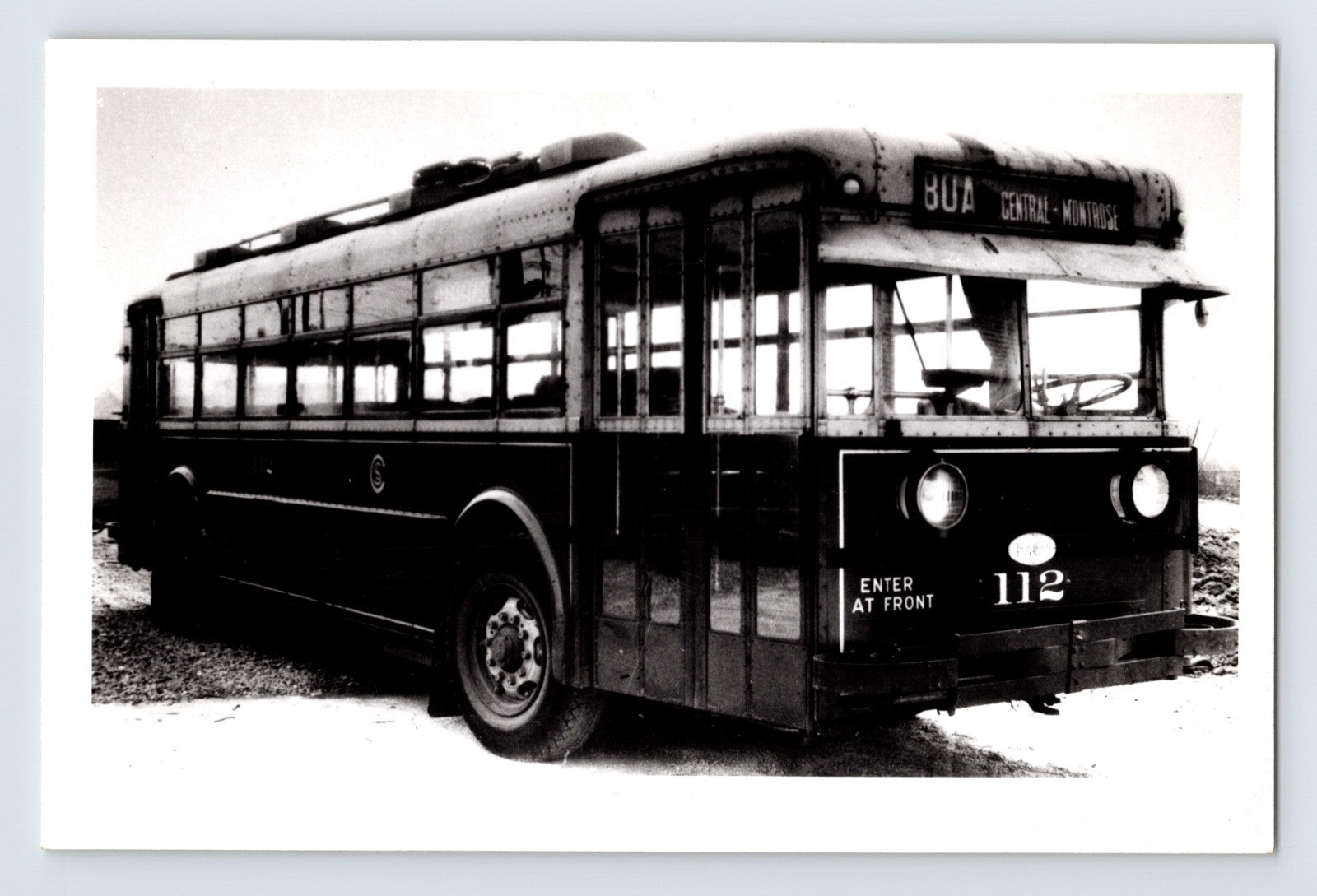 Chicago Surface Lines trolley bus 112 displaying BOA Central Montrose route sign, black and white 1960s urban transit photograph
