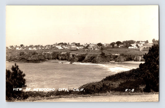 Mendocino California coastal view with bluffside homes overlooking small cove, real photo postcard 1950s
