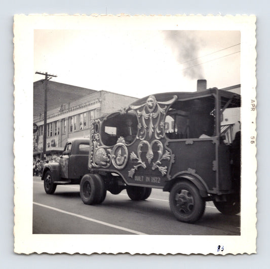 1955 Cole Bros Circus parade wagon snapshot photograph showing an ornate carved calliope-style circus vehicle moving through downtown Decatur GA streets during a parade procession