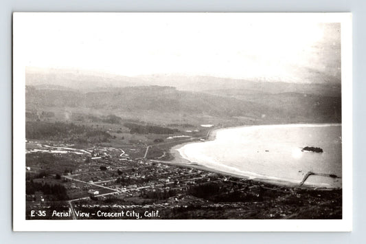 Crescent City California aerial view 1940s RPPC postcard showing coastline town harbor and beach