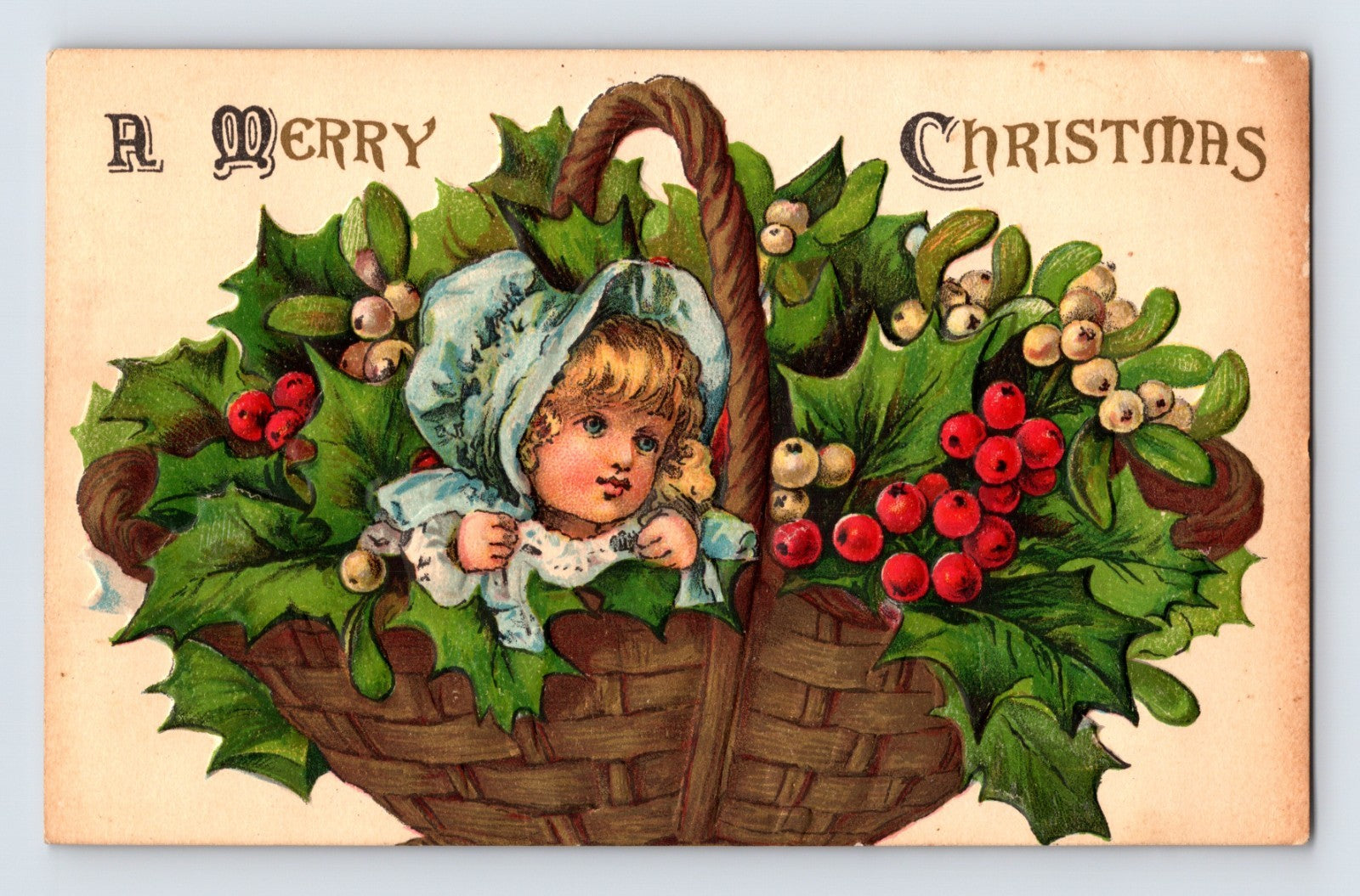 Baby in holly basket Christmas postcard 1916 posted Charlotte Michigan